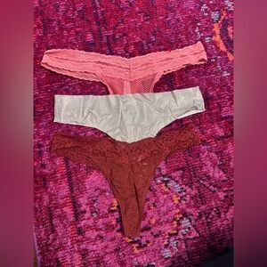 Set of Three Lace Thongs in Pink, Shimmer Gold, and Red